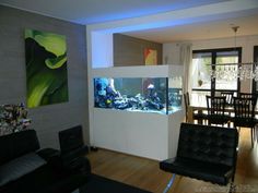 a living room filled with furniture and an aquarium