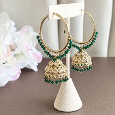 Add a glamourous twist to your ordinary golden hoops with these classic bali jhumkas! These earrings come in a beautiful antique gold color with a variety of colored contrasting beads embellishing the hoops. Perfect for your casual occasions without going over the top! Items are carefully packed and ready for gifting. All pictures are taken in natural light please allow for slight variations in color due to camera settings. Jewelry Care ✨Protect your jewelry in a closed box or pouch   ✨Wear jewe Elegant Hoop Danglers With Latkans, Elegant Festive Hoop Danglers, Festive Hoop Danglers, Hoop Earrings For Pierced Ears For Celebration, Gold Bollywood Hoop Earrings For Party, Festival Hoop Earrings, Festive Green Chandbali Hoop Earrings, Bollywood Style Gold Hoop Earrings For Celebration, Festive Hoop Earrings