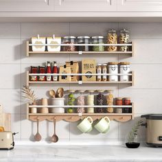 a kitchen counter with spices and other items on the shelves above it, next to an air fryer