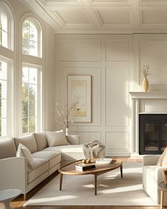 a living room filled with furniture and a fire place in front of a fireplace covered in windows