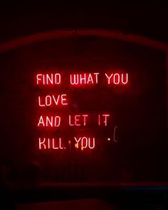 a red neon sign that says find what you love and let it kill you on the wall