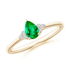 A rich green emerald is secured in a prong setting and flanked by sparkling diamond clusters. Designed in 14k yellow gold, this pear-shaped emerald ring looks breathtakingly elegant. Emerald Solitaire Ring, Tsavorite Ring, Contemporary Ring, Sparkling Diamond, Diamond Solitaire Rings, Diamond Cluster, Sparkle Diamonds, Emerald Ring, Gold Platinum