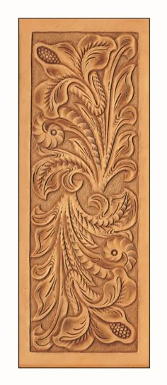 an intricately carved wood panel with flowers and leaves in the shape of a bird