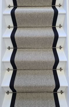 a stair case with black and white chevrons