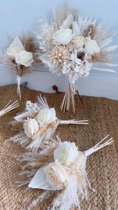 wedding bouquets with feathers and flowers on the floor