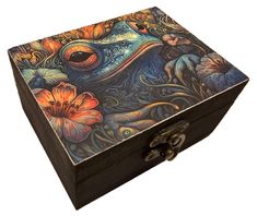 an ornate wooden box with flowers painted on it