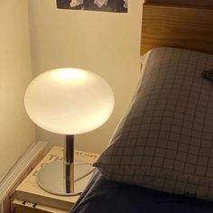 a bed with a lamp on top of it