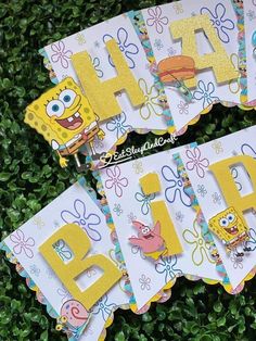 spongebob themed birthday party decorations on top of green grass with the letters happy b and c