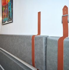 two gray and orange benches in a room