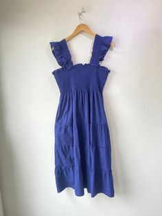 Hill House Navy Nap Dress! Features a ruched bodice, matching straps, and a tiered midi dress silhouette. Has pockets! Unlined, cotton blend. Marked a size XL. In overall excellent condition with a small stain on the front. Approx. Measurements: Underarm to Underarm: 18" Waist: 44" Length: 46" Sleeveless Cotton Tiered Dress For Brunch, Casual Smocked Bodice Midi Length Tiered Dress, Casual Midi Tiered Dress With Smocked Bodice, Blue Cotton Tiered Dress For Vacation, Casual Tiered Dress With Smocked Bodice And Ruffled Straps, Solid Ruched Tiered Midi Dress, Ruched Tiered Midi Dress, Ruched Midi Dress With Ruffled Straps For Day Out, Cotton Sleeveless Tiered Dress For Day Out