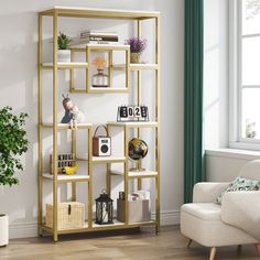 a living room filled with furniture and a book shelf next to a chair in front of a window