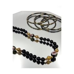 Vintage Black and Gold Cloisonné 29" Beaded Necklace and Bangle Set. Heavy Black Glass Beads with Beautifully Crafted Cloisonné Beads Throughout. Comes with 3 Matching Black and Gold Bangle Bracelets. Lovely Enamel Work with Pink, Blue, Green, Red, Black and Gold Colors. These are High Quality Pieces made with stunning Artisan craftsmanship. Necklace is 29 inches long (approx. chest length for most). Bangle Bracelet openings are 2 1/2 Inches wide. Fishhook Clasp Marked Silver on Necklace. Slight Wedding Jewelry With 108 Beads, Formal Multi-strand Black Bead Jewelry, Bohemian Single Strand Jewelry For Wedding, Bohemian Single Strand Wedding Jewelry, Traditional Black Bracelets For Weddings, Traditional Black Wedding Bracelets, Traditional Black Bracelet For Wedding, Elegant Hand-strung Beaded Necklaces For Party, Elegant Round Beads Bracelets For Celebrations