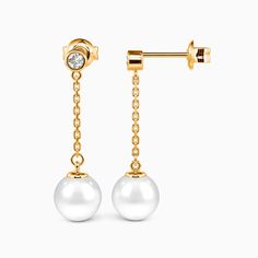 Effortlessly chic, these drop earrings showcase a round gemstone in a bezel setting, elegantly suspending a lustrous pearl. The gemstone's brilliance complements the pearl's soft glow, creating a harmonious balance of sparkle and shine. The pearl sways gently with every movement, adding a dynamic element to the design. *Each piece is handmade, resulting in a potential variance of 0.1-0.2mm during measurement. Please refer to the actual item for precise specifications. *Cultured pearls are natura Freshwater Pearl Drop Earrings, The Pearl, Pearl Drop Earrings, Pearl Drop, Cultured Pearls, Bezel Setting, Personalized Jewelry, Fresh Water, Freshwater Pearls