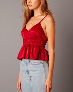 This flirty stain top features elasticized empire waist and ruffle trim. Wear this with a mini skirt and your favorite pair of heels for date night! Imported S M L BUST (OPEN BACK) 24" 26" 28" WAIST 26" 28" 30" LENGTH 18" 18" 18" Fitted Ruffled Peplum Top For Night Out, Summer Party V-neck Peplum Top, Flirty Party Tops With Ruffle Hem, Summer Ruffled Peplum Top For Night Out, Summer Ruffle Hem Top For Date Night, Summer Date Night Top With Ruffle Hem, Flirty Ruffled Peplum Top For Summer, Fitted Flirty Summer Peplum Top, Fitted Flirty Peplum Top For Summer