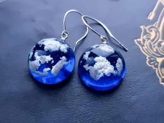 Handmade by myself. !You will get gift package with each order! This is a beautiful earrings with blue sky and white clouds, made with stainless steel hooks.  Dimensions: sphere diameter -0.79'' (2 cm)  earring length with hooks - 1.38'' (3.5 cm) REGULATIONS OF THE USE: *Resin jewelry must be kept separately from other jewelry (to avoid scratches)  *To restore gloss wipe with a soft cloth (velvet, flannel, glasses cleaning cloth) Affordable Blue Resin Earrings, Air Witch, Fairy Nature, Earrings Cottagecore, Cottagecore Wedding, Strega Fashion, Sky With Clouds, Birthday Gift For Girlfriend, Terrarium Jewelry