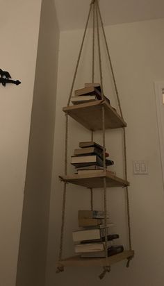 a hanging book shelf with books on it