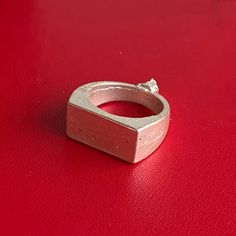 This ring base is ideal for soldering, carving, engraving, or adding bezels and stones to, this signet ring offers endless creative possibilities. It's beautiful on its own as well as a minimalist ring.  Size 5 3/4 Front Rectangle Measurement 17mm Length across x 8.5mm Height Casting done in-house Piece is ONLY pickled and Tumbled, additional polishing and filing may be required Ships in 5-7 business days in a padded mailer, via USPS First Class with tracking or First Class International. Other Handmade Rectangular Minimalist Rings, Handmade Minimalist Rectangular Rings, Unique Rectangular Engraved Rings, Minimalist Rectangular 925 Stamped Jewelry, Minimalist Signet Ring With Rectangular Stone As Gift, Minimalist Signet Ring With Rectangular Stone For Gift, Everyday Engraved Rectangular Ring, Adjustable Rectangular Signet Ring As Gift, Adjustable Rectangular Signet Ring Gift