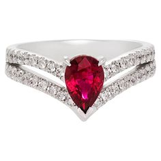 Pear Ruby Ring, Classic Teardrop Ruby Ring For Formal Occasions, Formal Pear-shaped Ruby Ring, Formal Red Pear-shaped Ruby Ring, Classic Teardrop Ruby Ring, Red Ruby Ring With Brilliant Pear-shaped Cut, Diamond Ruby Ring With Prong Setting In Pear Shape, Formal Teardrop Ruby Ring In Fine Jewelry Style, Red Pear-shaped Ruby Ring With Brilliant Cut