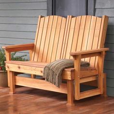 a wooden bench sitting on top of a hard wood floor