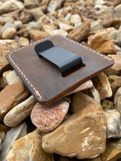 "Every wallet is handmade to order from high-quality buffalo leather. -Minimalist Design -2 front pockets, 1 main pocket -Metal money clip on backside -White stitching -Finished edges -Dimensions: 3.75\" x 3\" Our brown crazy horse buffalo leather is soft and durable and will develop beautiful character over time. This minimalist style wallet is the perfect gift for anyone and is carefully handcrafted by us here in our shop. Feel free to message us with any questions! Minimalist Leather Wallet, Rectangular Trifold Wallet With Belt Clip For Everyday Use, Handmade Leather Wallets For Everyday Carry, Everyday Use Trifold Wallet With Belt Clip, Brown Wallet With Belt Clip For Everyday Carry, Leather Rectangular Card Holder For Everyday Carry, Leather Card Holder For Everyday Carry, Leather Card Holder With Belt Clip For Everyday, Leather Trifold Wallet With Belt Clip For Everyday, Leather Bifold Card Holder With Belt Clip