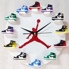 a clock with different colored shoes painted on the front and side of it that says air jordan