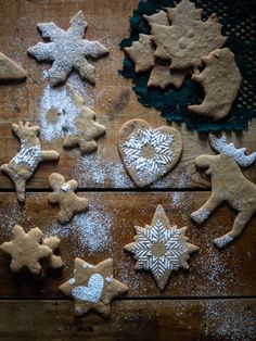 several different types of cookies on a wooden table