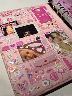 a pink book with pictures and hearts on it