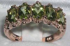 "*This ring is made from 585 14K (14ct 14Kt) Rose Gold with Genuine Natural Peridots. This is a beautiful Antique Style 14K Rose Gold ring set with five 6x4mm (0.24\"x0.16\" inches) vibrant natural Peridot gemstones in a stunning solid 14K Yellow Gold setting with carving on the shoulders.  This ring is handcrafted from Solid English 14K Gold and tested and fully Hallmarked by the London Assay Office.   All the Gemstones are Genuine Natural Gemstones, hand-selected for color and clarity. If you have any specific gemstone requirements then please do convo me. PLEASE MAKE SURE YOU STATE THE FINGER SIZE YOU REQUIRE WITH YOUR PAYMENT AND ALSO INCLUDE YOUR TELEPHONE NUMBER FOR DELIVERY COURRIER. < CUSTOMIZATION > This ring can be customized to your requirements  - 9K, 14K, or 18K Yellow, Rose o Peridot Engagement Rings, Rose Gold Ring Set, Ring Rosegold, Victorian Rings, 14k Rose Gold Ring, Eternity Band Ring, Yellow Gold Setting, Peridot Gemstone, Green Peridot