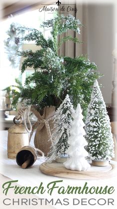 a french farmhouse christmas decor with pine trees and evergreens is featured in this postcard