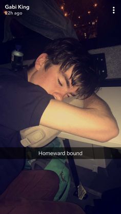 a man sleeping on top of a white table