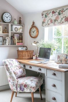 a desk with a chair and a laptop on it, in front of a window