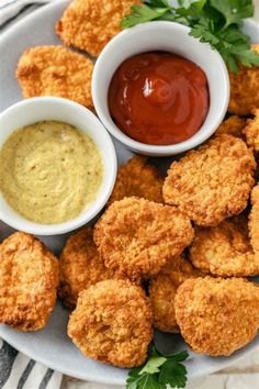 fried food on a plate with dipping sauce