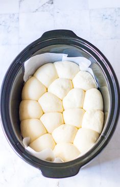 the food is being prepared in the crock pot