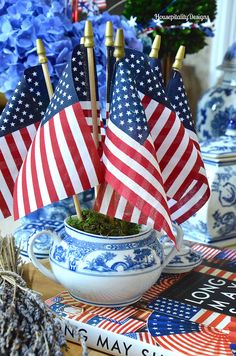 an american flag is in a bowl on a table