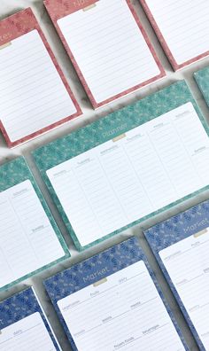 several notebooks lined up on top of each other