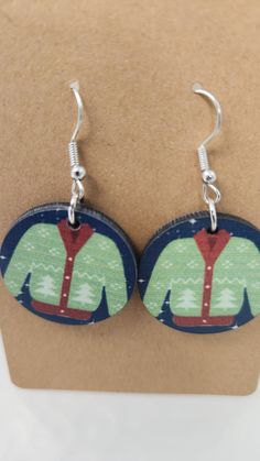 Christmas bells round design.  handmade earrings with my designs and artwork.  1 inch round Handmade Round Christmas Earrings, Ear Hook, Round Design, Christmas Bells, How To Make Earrings, Handmade Earrings, Jewelry Earrings Dangle, Dangle Drop Earrings, Dangle Earrings