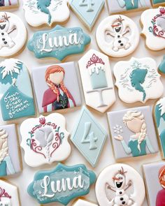 decorated cookies with frozen princess characters on them