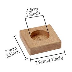 a wooden block with measurements for the hole