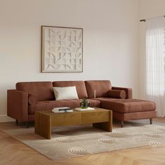 a living room with a brown couch and coffee table