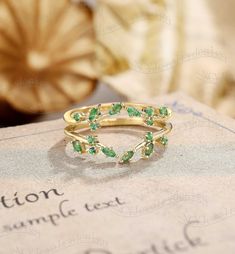 Wedding Band Details Emerald Enhancer Band, Leaf Emerald Ring, Branch Emerald Ring, Floral Vine Wedding Band, Nature Inspired Emerald Ring Yellow Gold Ring#:NC16288 Stones: Natural Emerald Marquise cut 1.5*3mm Custom orders are most welcome! Please feel free to ask for any item, any adjustments or anything else you want me to make. Rush order Orders can be expedited for a fee. If your order needs to be expedited, please contact us ASAP. Layaway plan We offer layaway plan that works with a $100 a Emerald Wedding Rings Gold, Gold Vine Wedding Band, Emerald Stone Engagement Ring Green, Emerald Leaf Ring, Open Band Diamond Wedding Ring With Gemstone, Wedding Diamond Ring With Open Band, Stackable Emerald Ring With Diamond For Wedding, Gold Stackable Emerald Ring For Wedding, Yellow Gold Emerald Ring For Wedding