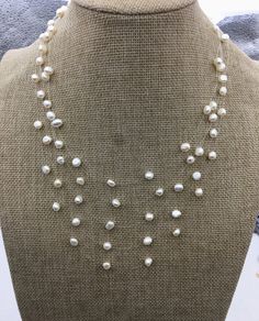 "quantity: 1 pc pearl jewelry: floating pearl necklace pearl body: please look at picture necklace length: 16.5''+2''extends pearl grade:AA+ pearl luster:high pearl shape:baroque pearl size: 6-7mm pearl colour: white packaging: beautiful pouch ---All style of illusion necklace--- https://www.etsy.com/hk-en/shop/WenPearls?ref=hdr_shop_menu&search_query=NPN3 Back to Other Jewelry Section 01: \"Tahitian,Akoya,Sea Pearl\" Section: https://www.etsy.com/shop/WenPearls?section_id=15806339 02: \"Potato/ Delicate Double Strand Pearl Necklace, White Double Strand Pearl Layered Necklace, White Pearl Double Strand Layered Necklace, Pearl White Multi-strand Necklace With Pearl Pendant, Pearl White Multi-strand Pearl Necklace, Multi-strand Pearl White Necklace With Pearl Pendant, Adjustable Multi-strand Pearl Necklace, Multi-strand Pearl Drop Necklace, Multi-strand Pearl Necklace With Pearl Charm