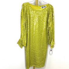 New Vicky Tiel Sequin Party Cocktail Dress With Split And Cuff Sleeve. Knee Length Dress. Size Small. New With Tag Nwt Length 40 Inches Bust 36 Inches Waist 34 Inches Hip 38 Inches Knee-length Sequin Dress For Spring Formal Events, Knee-length Sequin Dress For Spring Formal, Long Sleeve Stretch Dress For Festive Occasions, Festive Stretch Long Sleeve Dresses, Spring Formal Knee-length Sequin Dress, Stretch Dresses For Dinner And Party Season, Stretch Dresses For Dinner During Party Season, Festive Long Sleeve Stretch Dress, Spring Festive Sequin Dress