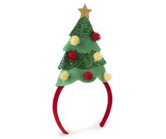 a green christmas tree headband with pom - poms