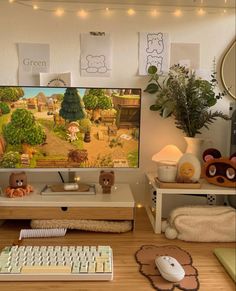 a flat screen tv sitting on top of a wooden desk next to a keyboard and mouse