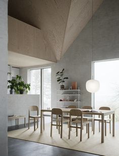 a dining table and chairs in a room