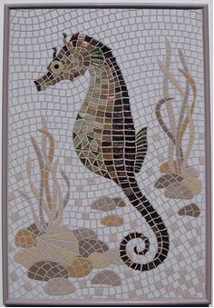 a mosaic tile with a sea horse on it