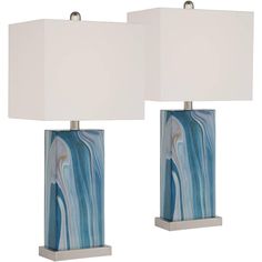 two lamps with blue and white designs on them