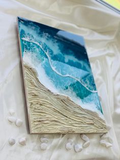 a piece of art that looks like waves on the beach