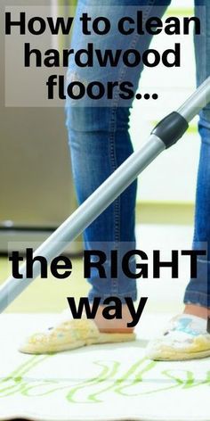 a woman is using a vacuum to clean the floor