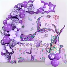 a mermaid themed birthday party with balloons and decorations